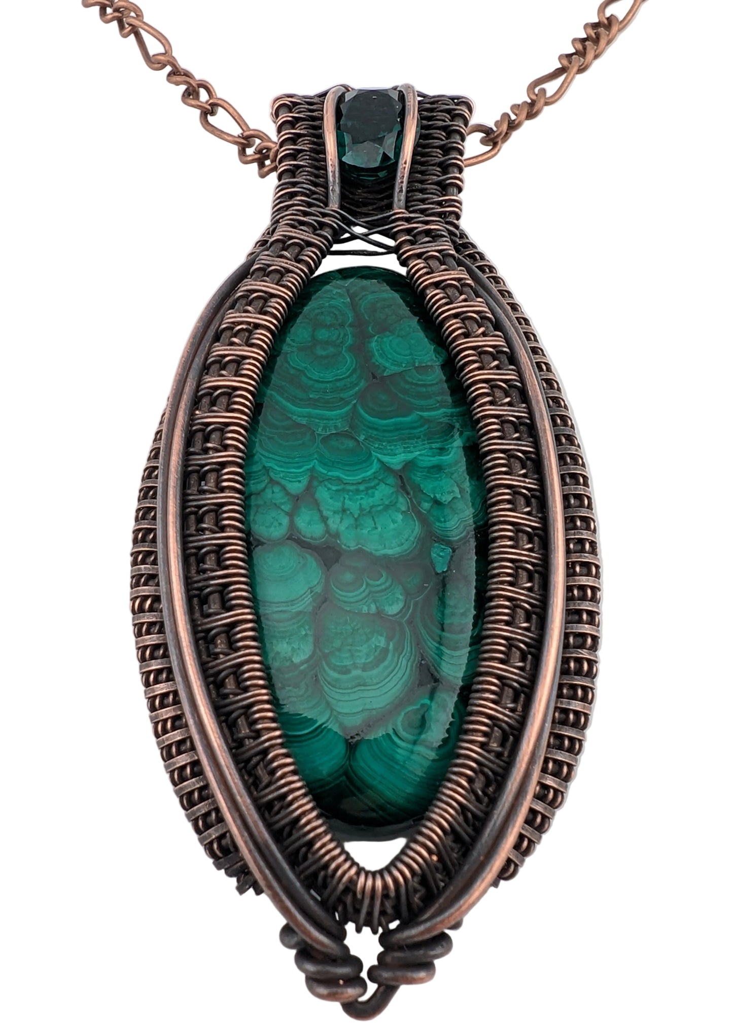 Necklace with a green stone and copper wire wrapping on a white background