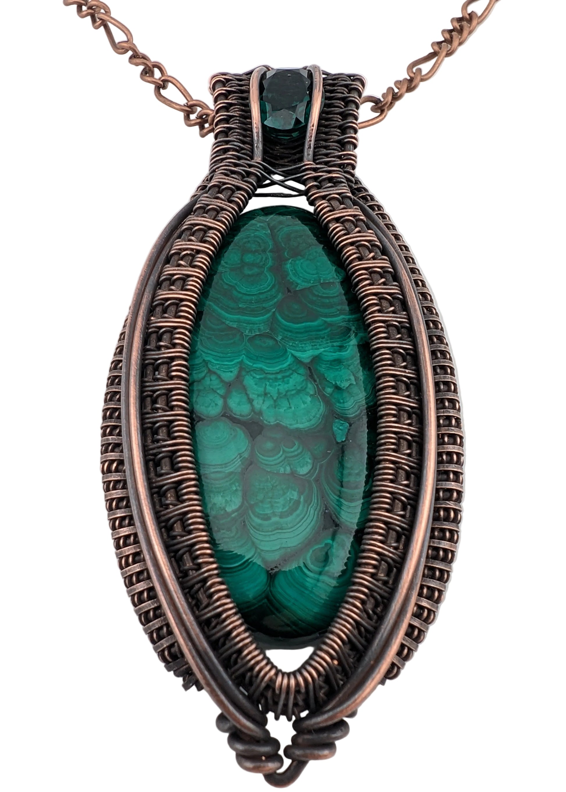 Necklace with a green stone and copper wire wrapping on a white background